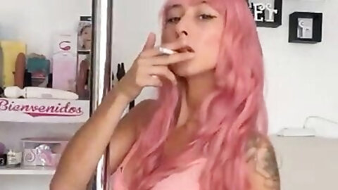 A sweet girl dances sexy while smoking