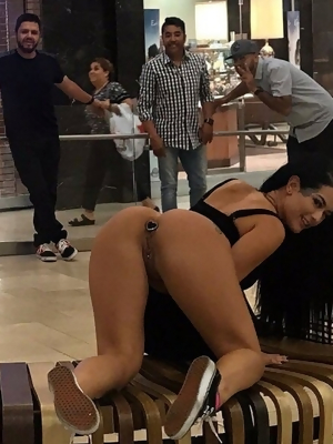 Showing off her new Anal Plug at the mall